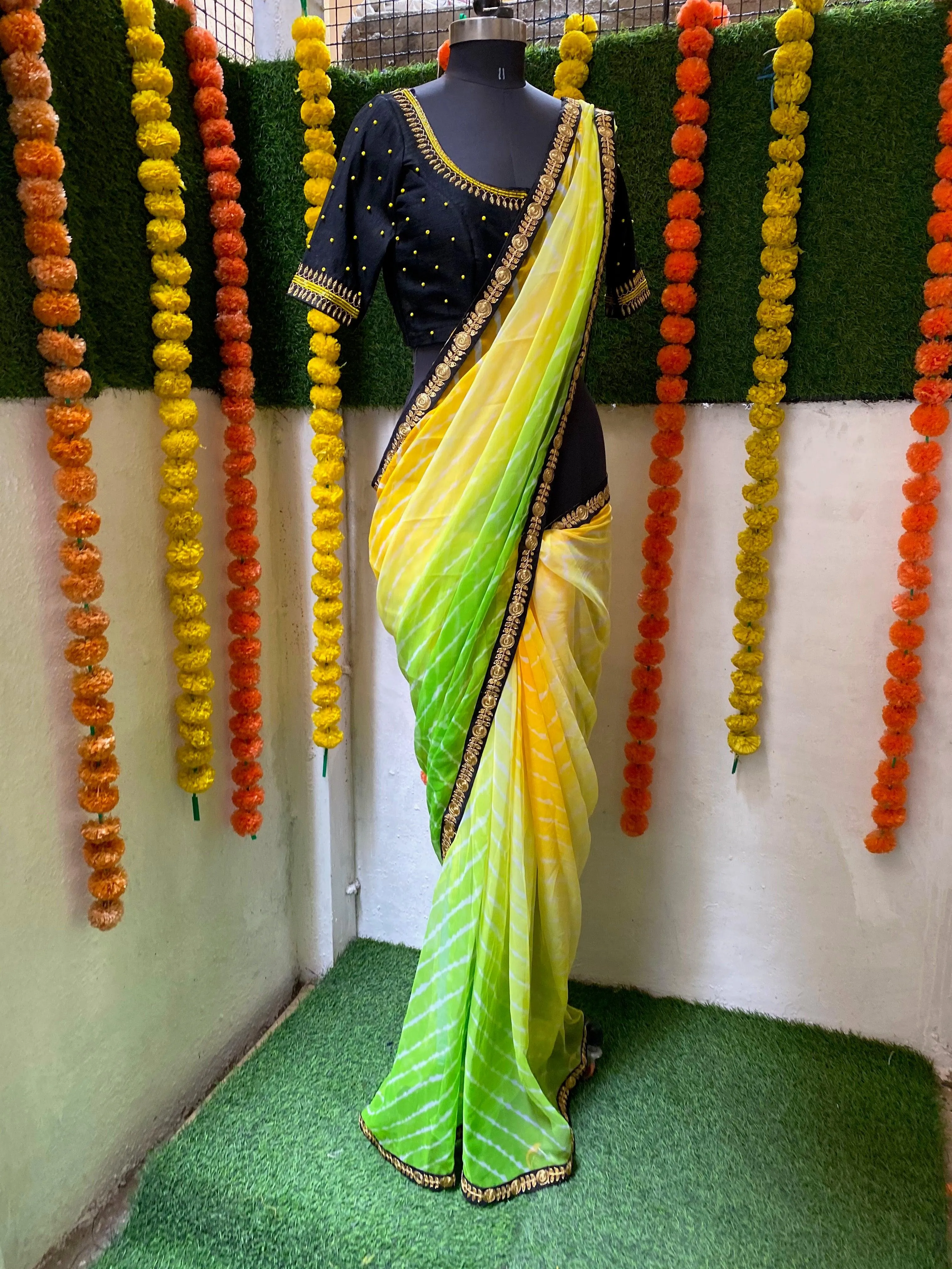 Tie and die green and yellow saree with aari work blouse