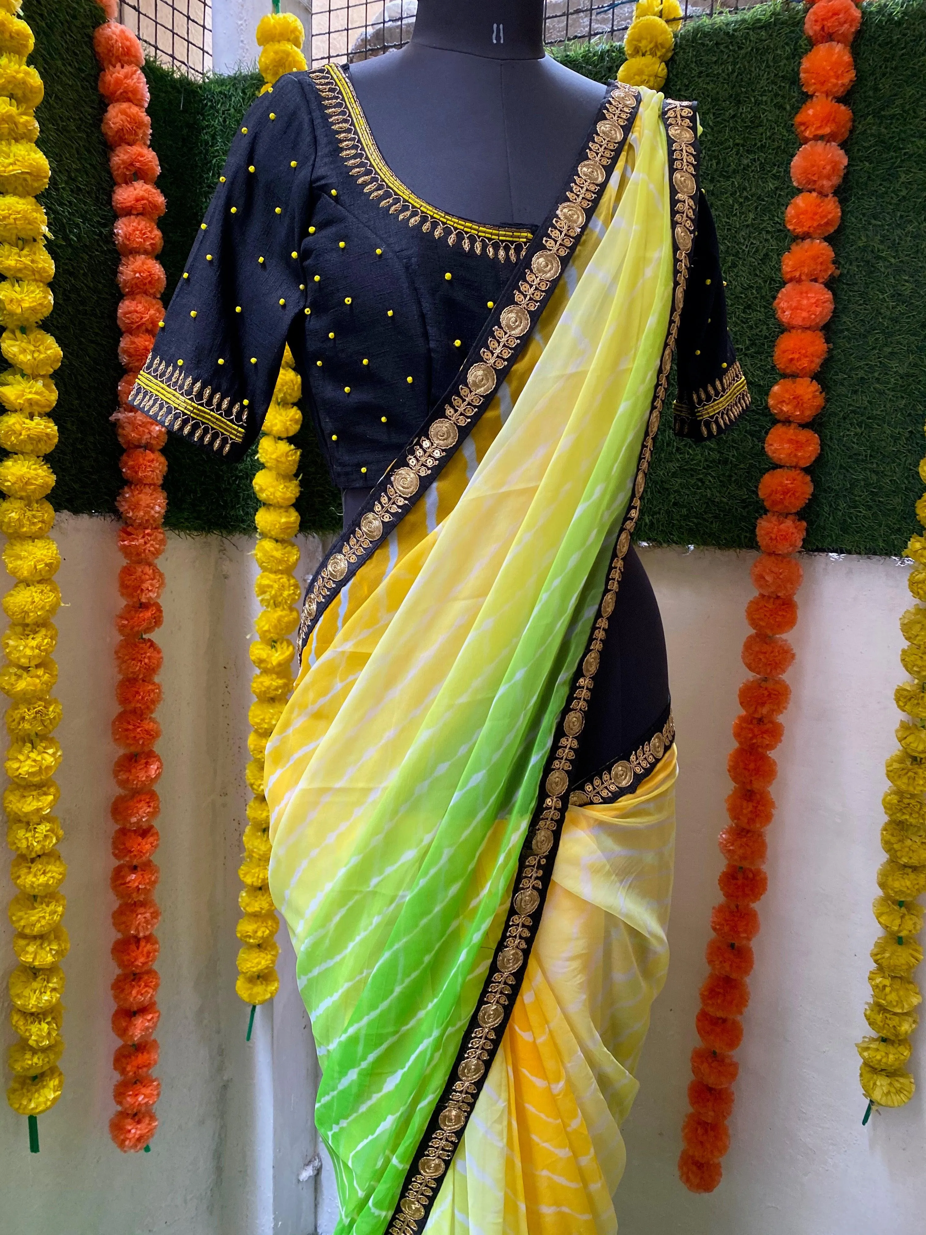Tie and die green and yellow saree with aari work blouse