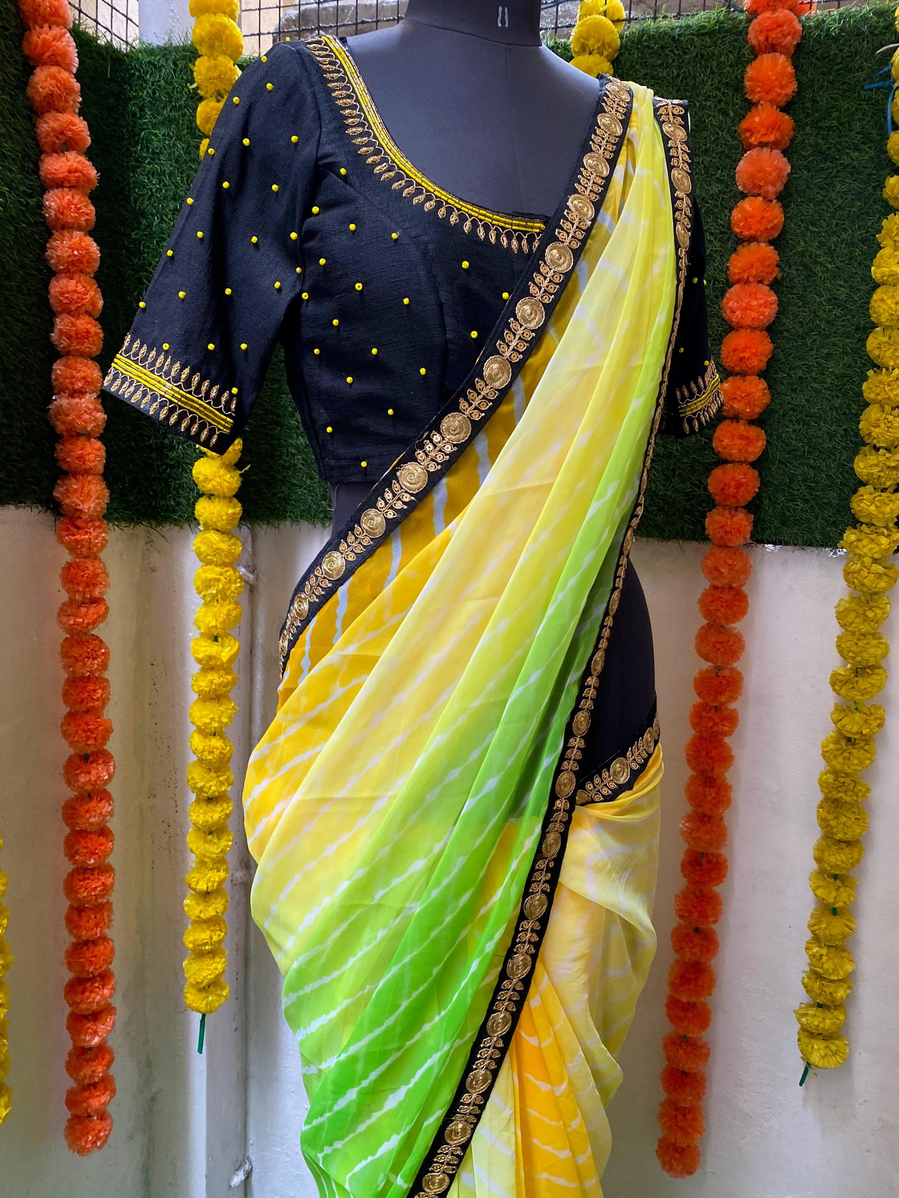 Tie and die green and yellow saree with aari work blouse