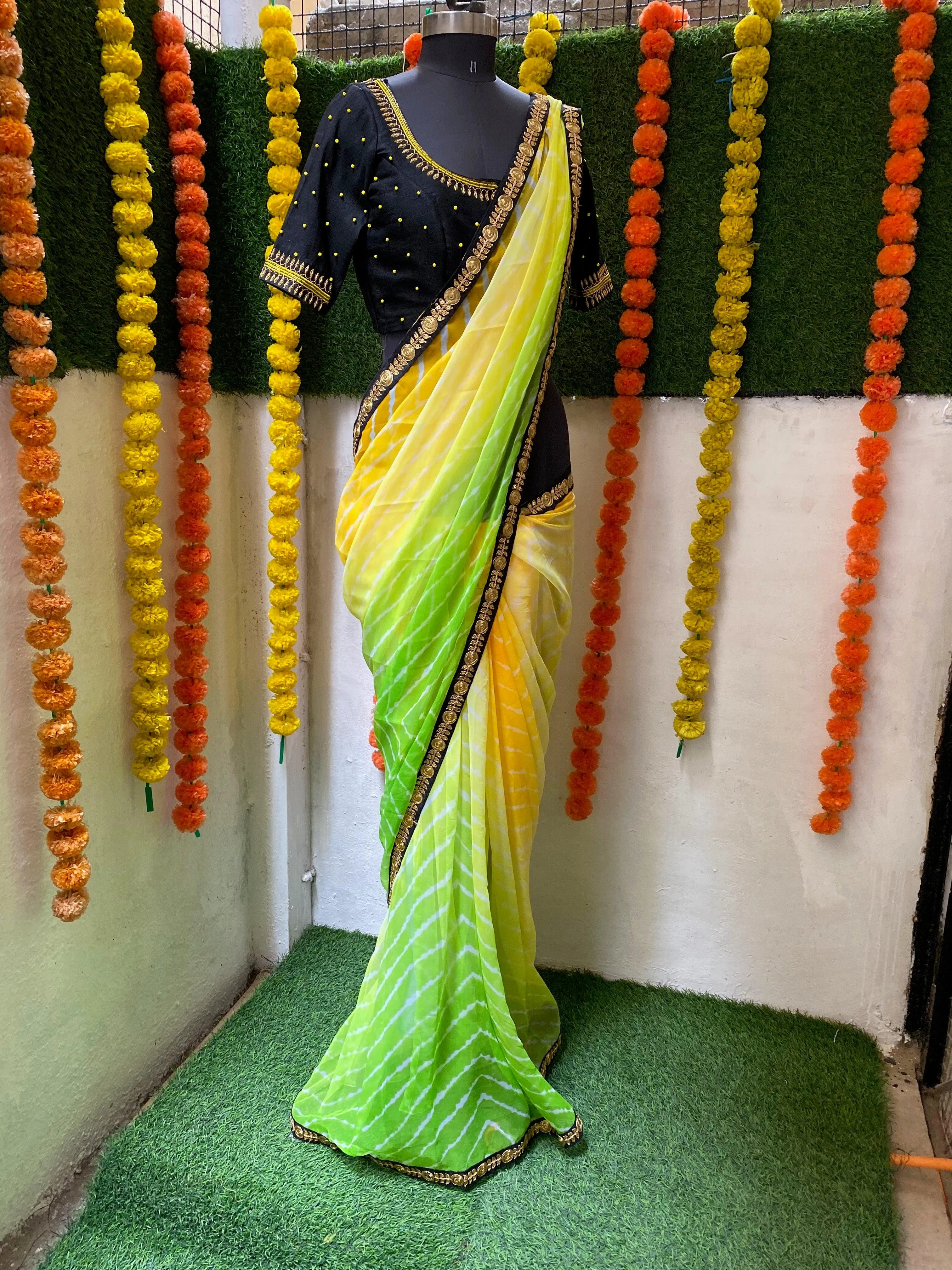 Tie and die green and yellow saree with aari work blouse