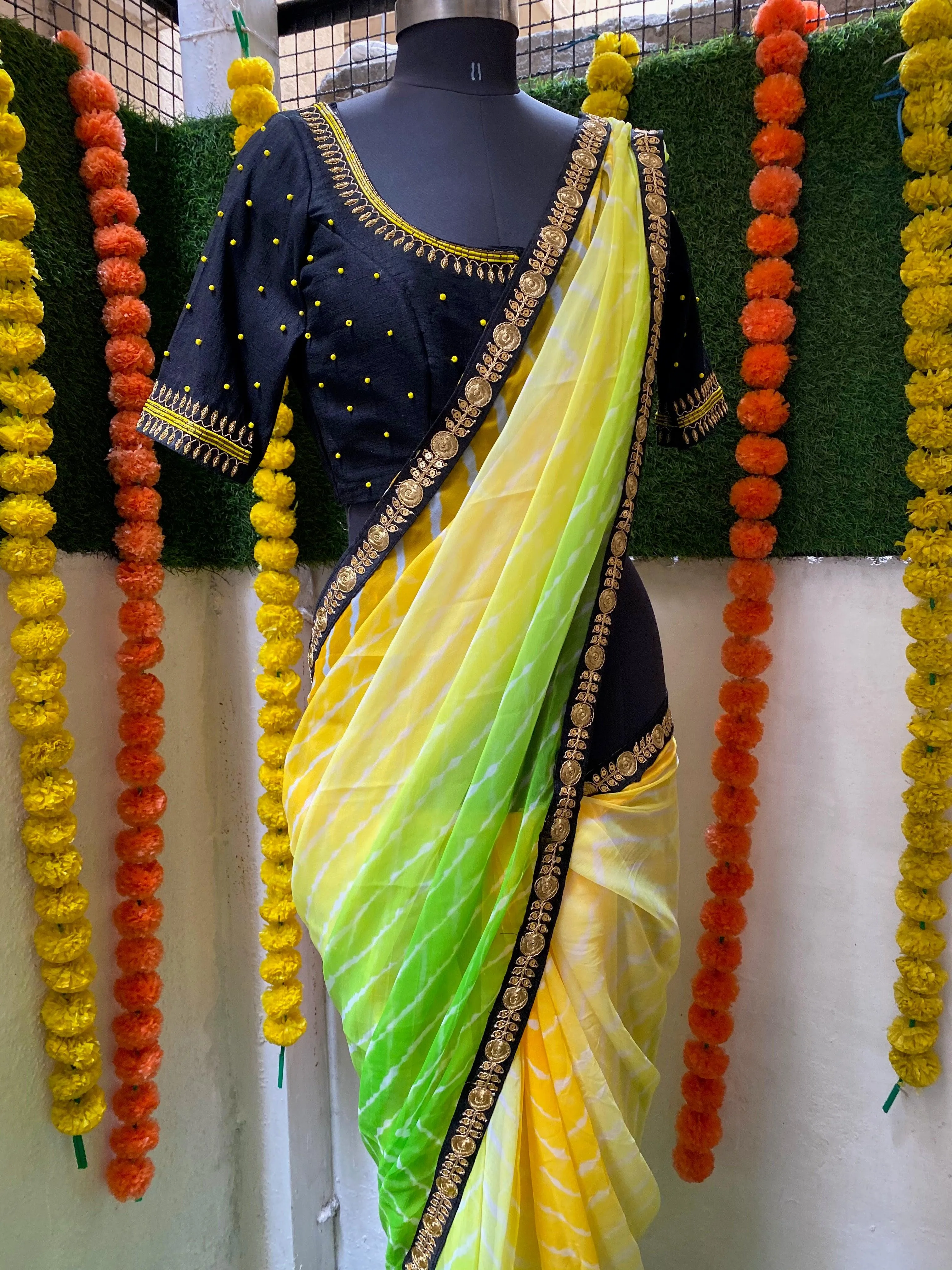 Tie and die green and yellow saree with aari work blouse